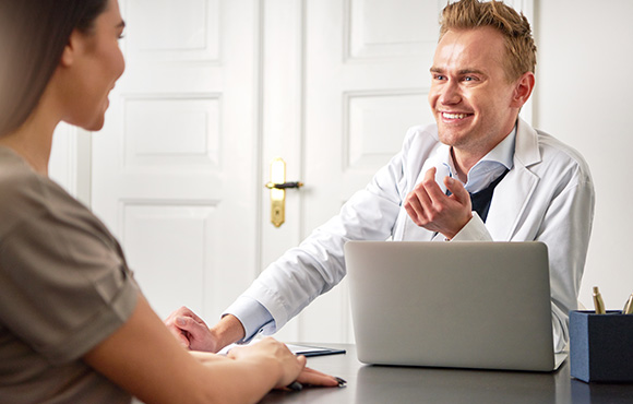 doctor consulting with patient in an office setting discussing health and wellness options for adults aged 18 and above